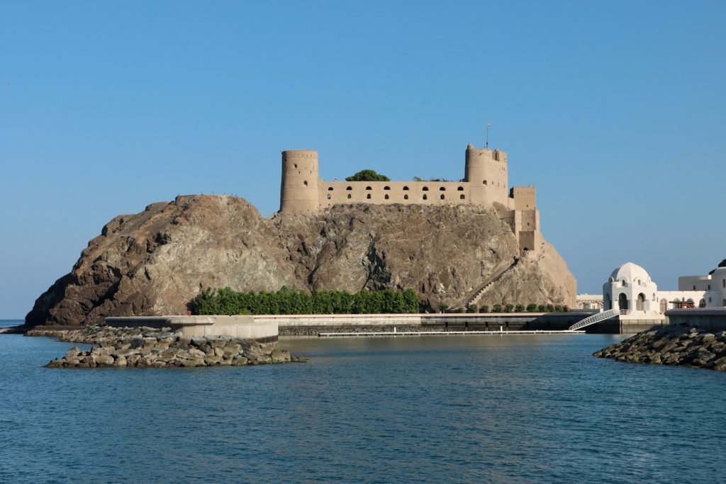 Historic fort on a rocky headland by the sea in Muscat, Oman